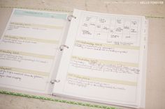 an open planner book sitting on top of a table