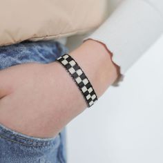 These handcrafted checkered bracelets are made with glass Tila beads and make the perfect accessory to finish off your outfit. Checkered Beaded Earrings, Checkered Necklace, Checkerboard Bracelet Pattern, Checkered Seed Bead Ring, Checkered Kandi Cuff, Black Cream, Cubbies, Cream, Beads