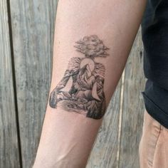 a person with a tattoo on their arm