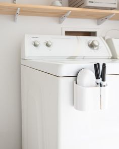 a white washer and dryer sitting next to each other