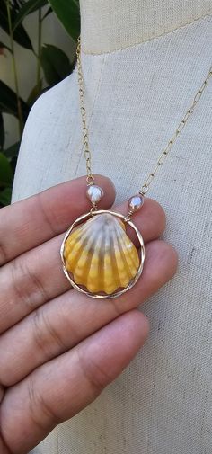 Sunrise Seashell 14K Gold Filled Necklace with Keshi Pearls Chain and Others -14K Gold Filled  Bright Sunrise Seashell  Actual Shell Shown Sunrise Seashell are ONLY found in Hawaii Note: This Jewelry is handmade in Lahaina Hawaii. After the Wildfire, taking over our entire town, burning four of our family houses down to the ground,  with not a single possessions saved,  including a jewelry business...I didn't know how to do it all over again. But thankful from donated materials and Gemstones, I Sunrise Shell Necklace, Sunrise Shell Jewelry, Gold Shell Necklace Made Of Mother Of Pearl, Handmade Gold Shell Pearl Necklace, Gold Mother Of Pearl Shell, Gold Shell-shaped Pearl Necklace, Gold Shell With Pearl Pendant, Gold Shell-shaped Mother Of Pearl Necklace, Gold Shell-shaped Jewelry For Anniversary