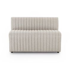 an upholstered sofa with two rows of lines on the back