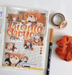 an open book with anime characters on it next to some scissors, tape and other items