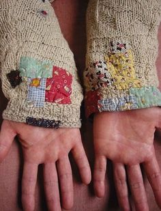 two hands with patchwork on them and one hand in the other's mitts