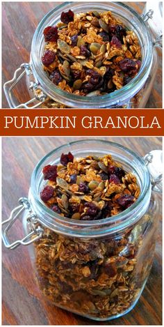 two jars filled with granola sitting on top of a wooden table