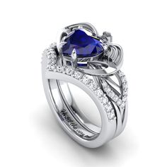 a heart shaped blue sapphire engagement ring set with diamond accents on the shoulders and sides