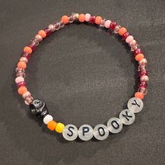 Halloween Friendship Bracelets that Jack Skellington would love. Halloween Beaded Bracelets With Letter Beads, Halloween Bracelets With Letter Beads And Round Shape, Halloween Letter Beads Bracelet With Round Beads, Halloween Jewelry With Round Letter Beads, Taylor Swift Friendship Bracelet, Disney Bracelet, Bracelet Inspo, Halloween Bracelet, Beads Bracelet Design