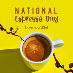 a cup of hot chocolate sitting on top of a yellow table next to the words national espresso day