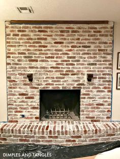 a brick fireplace is being installed in a living room