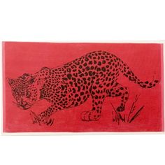 a red towel with a black and white leopard on it