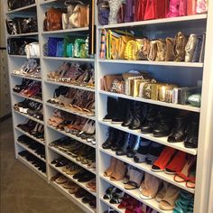 there are many pairs of shoes on the shelves