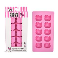 the hello kitty ice tray is pink and has six small pieces of cake in it