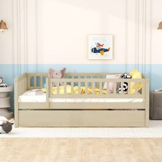 a baby's room with a crib and toy animals on the floor next to it