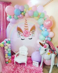 a unicorn themed birthday party with balloons and decorations