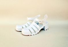 white gel shoes plastic shoes rubber shoes jelly shoes 90s sandals vintage sandals size eu 37 uk 4 us 6 gelly recycled plastic summer shoes ----------------------------------------------------------------------------------- White jelly sandals. Made of 100% PVC! how iconic these shoes are. In new condition could be styled so well. see all images for details Sole is 5 cm ( 2 inches) high in the back and 1.5 cm ( 0.5 inches) in the front side of the shoe Condition : NEW / UNWORN Size Chart: UK Siz Gel Shoes, 90s Sandals, Shoes 90s, Sandals Vintage, Vintage Sandals, Plastic Shoes, Jelly Shoes, Rubber Shoes, Jelly Sandals