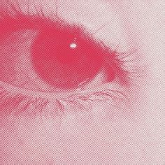 an eye is shown in red and white with the iris partially closed to reveal it's shadow