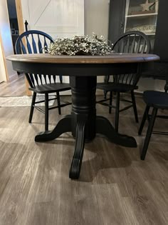 a dining table with chairs around it