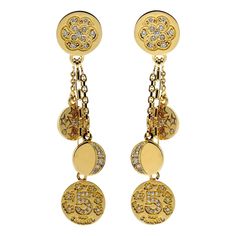 A magnificent pair of Chanel earrings featuring a diamond-encrusted iconic motifs set in 18k yellow gold. Length: 2.44″ Inches Inventory ID: 0000051 Chanel Charm, Chanel Yellow, Vintage Chanel Jewelry, Diamond Gold Earrings, Chanel Jewelry Earrings, Chanel Camellia, Yellow Gold Earrings, Chanel Earrings, Chain Fashion