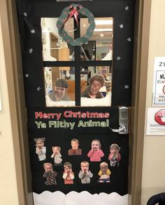 a door decorated for christmas with pictures of people