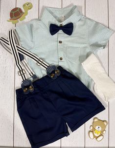 Boy navy shorts with suspenders, bowtie and striped light green shirt/romper shirt. 100% cotton. Size 12-18 months. Note: Shoes and socks not included, but available for purchase. Summer Bow Tie Sets, Shorts With Suspenders, Mint Outfit, Navy Shorts, Green Shirt, Outfit Set, Suspenders, Striped Shirt, Sock Shoes