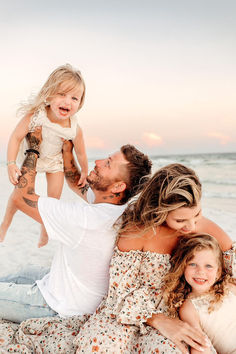 Mother and father holding their 2 daughters on the beach. Navy Beach Pictures, Family Of 4 Beach Photoshoot, Beach Family Poses, Family Of 4 Beach Photos, Family Of 5 Beach Pictures, Family Of 4 Beach Pictures, Family Beach Pics, Obx Pics, Beach Pictures Family