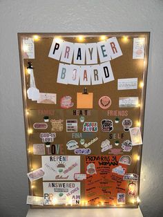 a bulletin board covered in magnets and paper with lights on it's sides