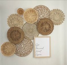 there are many wicker plates on the wall