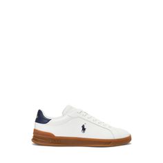 Inspired by shoes worn by early tennis professionals the Heritage Court II features a dual-compound EVA midsole and rubber cupsole construction with integrated heel support. This leather-and-suede version is accented with our iconic logo and signature Pony. Iconic Logo, Suede Sneakers, Shoes Mens, Tennis, Ralph Lauren, Heels, ? Logo, Sneakers, Leather