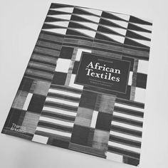 an african textiles book with black and white squares