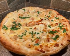 a pizza sitting on top of a stone counter