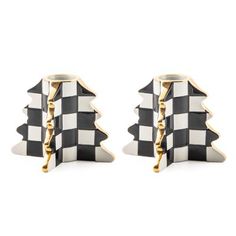 pair of black and white checkered cufflinks with gold tone accents, set against a white background