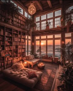 a living room filled with lots of furniture next to a window covered in bookshelves