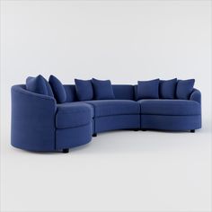 a blue sectional sofa with pillows on the top and bottom corner, in front of a white background