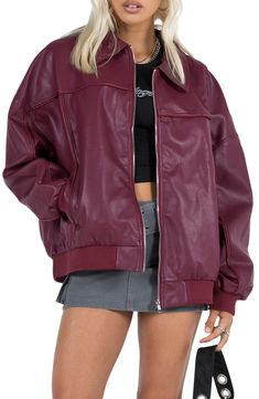 Go for an edgy look in this faux-leather bomber jacket sporting a glossy texture, an oversized fit and casual-cool ribbed trim. Front zip closure Spread collar Ribbed cuffs and hem Front welt pockets Lined 55% rayon, 45% polyester Dry clean Imported Solid Leather Jacket With Zipper For Streetwear, Casual Leather Jacket With Ribbed Collar, Trendy Leather Jacket With Zip Fly For Streetwear, Casual Faux Leather Outerwear With Zip Fly, Trendy Oversized Varsity Jacket For Fall, Oversized Casual Faux Leather Outerwear, Trendy Oversized Outerwear With Zipper Closure, Casual Oversized Faux Leather Outerwear, Sporty Leather Jacket With Zipper Closure For Winter