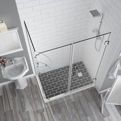 an aerial view of a bathroom with wood flooring