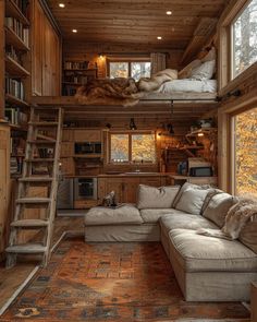 a living room filled with furniture and bookshelves