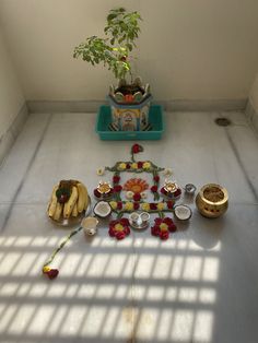 there are many different items on the floor in this room, including flowers and candles