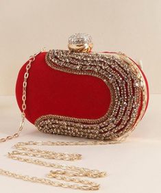 A soft blend of regal luxury, this gorgeous velvet clutch is embellished with sequins and stones and is perfectly sized to carry your essentials. Whether it is a wedding, party or social event, grab this stunning clutch to accessorise your outfit. With one main compartment and a magnetic fastening, this clutch is completed with a chain strap which can be worn as a shoulder bag or tucked in for a clutch style. Dimensions: 20cm x 12cm x 5cm Party Clutch With Rhinestones, Glamorous Clutch Evening Bag For Wedding Guest, Elegant Embellished Party Clutch, Glamorous Rhinestone Party Clutch, Elegant Rectangular Sequin Clutch, Glamorous Embellished Evening Bag, Elegant Hand Embellished Party Bags, Glamorous Rhinestone Clutch For Events, Glamorous Formal Clutch For Party Season