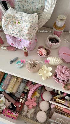 an organized drawer filled with cosmetics and other items