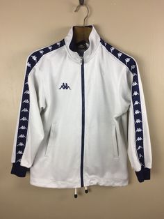 Vintage Kappa Track Zipper Jacket Side Tape Side Logo Streetwear  Trainer White Colors To Valuable Customers please ask before buying Please Don't Expected It Like New Or In Pristine Condition Measurement : Widht ( Armpit to Armpit ) : 21 inches Lenght ( Shoulder to end of garment ) : 25 inches Condition :Good Condition ( Please Refer Picture ) Tag : Kappa Size On Tag :  SHIPPING - All item will ship from malaysia and will be ship by post Malaysia - All items will be shipped out within 2-4 busin White Zipper Sweatshirt For Winter, White Winter Sweatshirt With Zipper Closure, White Zipper-closure Sweatshirt For Winter, Casual White Sweatshirt With Zipper Closure, White Long Sleeve Sweatshirt With Zipper Closure, White Crew Neck Track Jacket For Fall, White Zipper Track Jacket For Winter, White Track Jacket With Zipper Closure For Fall, White Zipper Closure Tops For Streetwear