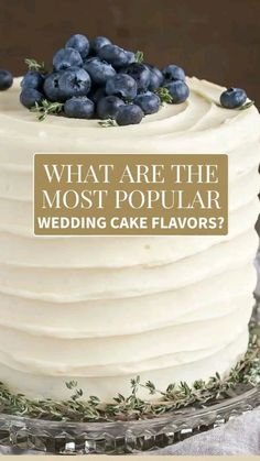 a white cake with blueberries on top and the words, what are the most popular wedding cake flavors?