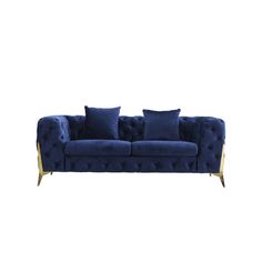 a blue velvet couch with gold legs and pillows on it, against a white background