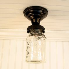 a mason jar is hanging from the ceiling