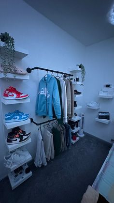 a room with clothes and shoes in it