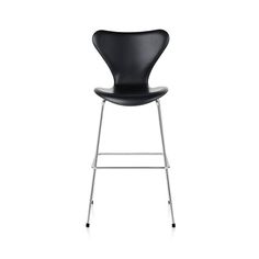 an image of a black chair with chrome legs and backrests on white background