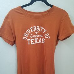 University Of Texas Longhorn T-Shirt. New And Ready For Game Day Youth Large School Spirit Graphic Print Tops For Spring, Spring Graphic Print Top For School Spirit, Short Sleeve School Spirit Shirt For Spring, School Spirit Short Sleeve Shirt For Spring, Short Sleeve Shirt With School Spirit For Spring, Orange Short Sleeve T-shirt For College, Short Sleeve Shirt For Spring With School Spirit, Pre-shrunk Tan Crew Neck Top, Tan Crew Neck Top