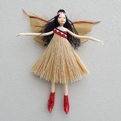 a doll hanging from the side of a wall