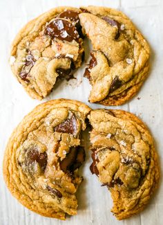 three chocolate chip cookies with one broken in half