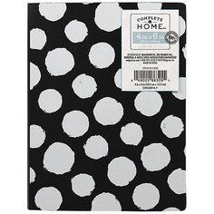 a black and white dotted notebook with the words compte home written on it