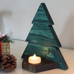 Light Up Your Home With This Beautiful Handcrafted Wooden Christmas Tree Candle Holder. This Hand Made Wooden Tree Stands 7.5" Tall, 6.5" Wide, And 3.25" Deep. Comes With An Led Candle. The Tree Is Stained Hunter Green And The Base Is Dark Walnut Stained. Wooden Christmas Tree Candle Holder, Woodwork Christmas Projects, Homemade Christmas Gifts Wood, Handmade Wood Christmas Gifts, Diy Christmas Wooden Decorations, Cedar Christmas Decorations, Wooden Christmas Tree Decor, Handmade Wood Gifts, Easy Wood Christmas Crafts